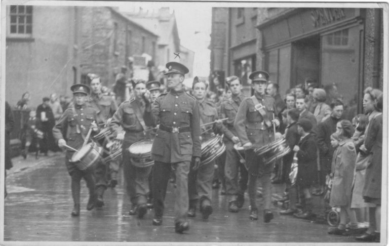 This was taken when he was Acting as Drum Major in war weapons week 1943